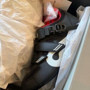Peloton Shoes- brand new. Never worn. Men's Black Cycling Shoes with Red Accents